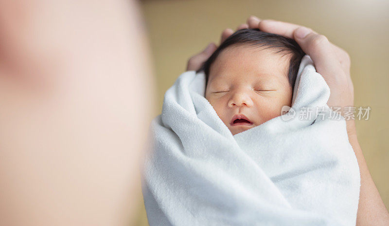 Portrait of young asian father or mother with healthy newborn baby, copy space with bed in the hospital background. Single caucasian dad, happy family healthcare and father's day concept top view banner